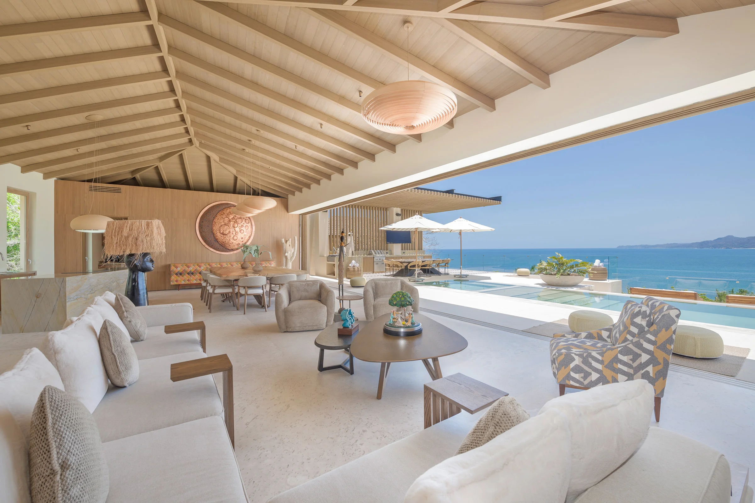 Pool terrace with ocean view and umbrellas